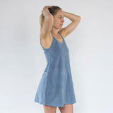 Front and side profile of Aisling organic cotton short dress, showing elegant fit and drape. Naturally dyed Indigo for sensitive skin