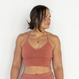 Front view of model wearing Branna organic cotton razorback bra, showing soft, supportive fit. Naturally dyed with Rubia