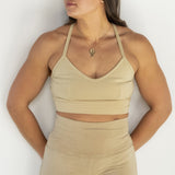 Front view of model wearing Branna organic cotton razorback bra, showing soft, supportive fit and wider strap. Naturally dyed with pomegranate for sensitive skin