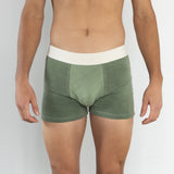 Front view of model wearing Finnbar organic cotton men’s underwear, showcasing close, supportive fit. Shades of Mulberry Green