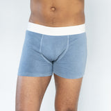 Front view of model wearing Finnbar organic cotton men’s underwear, showcasing close, supportive fit. Indigo