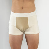 Front view of model wearing Finnbar organic cotton men’s underwear, showcasing close, supportive fit. Cream side panels with Pomegranate front panel