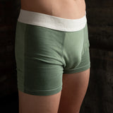 Front view of model wearing Finnbar organic cotton men’s underwear, showcasing close, supportive fit. Non -toxic dyes. Shades of Mulberry Green