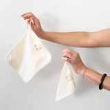 Little Brin cream organic cotton flannel hanging by its fabric loop, showcasing minimalist design and soft texture. Sustainable and friendly for sensitive skin