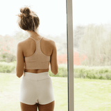 Back view of model showcasing the sporty fit of Lui organic cotton booty shorts