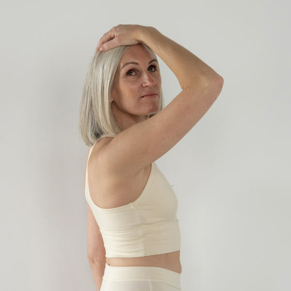 Side profile of Branna organic cotton bra, highlighting soft contour and breathable fabric. Beautiful cream for sensitive skin